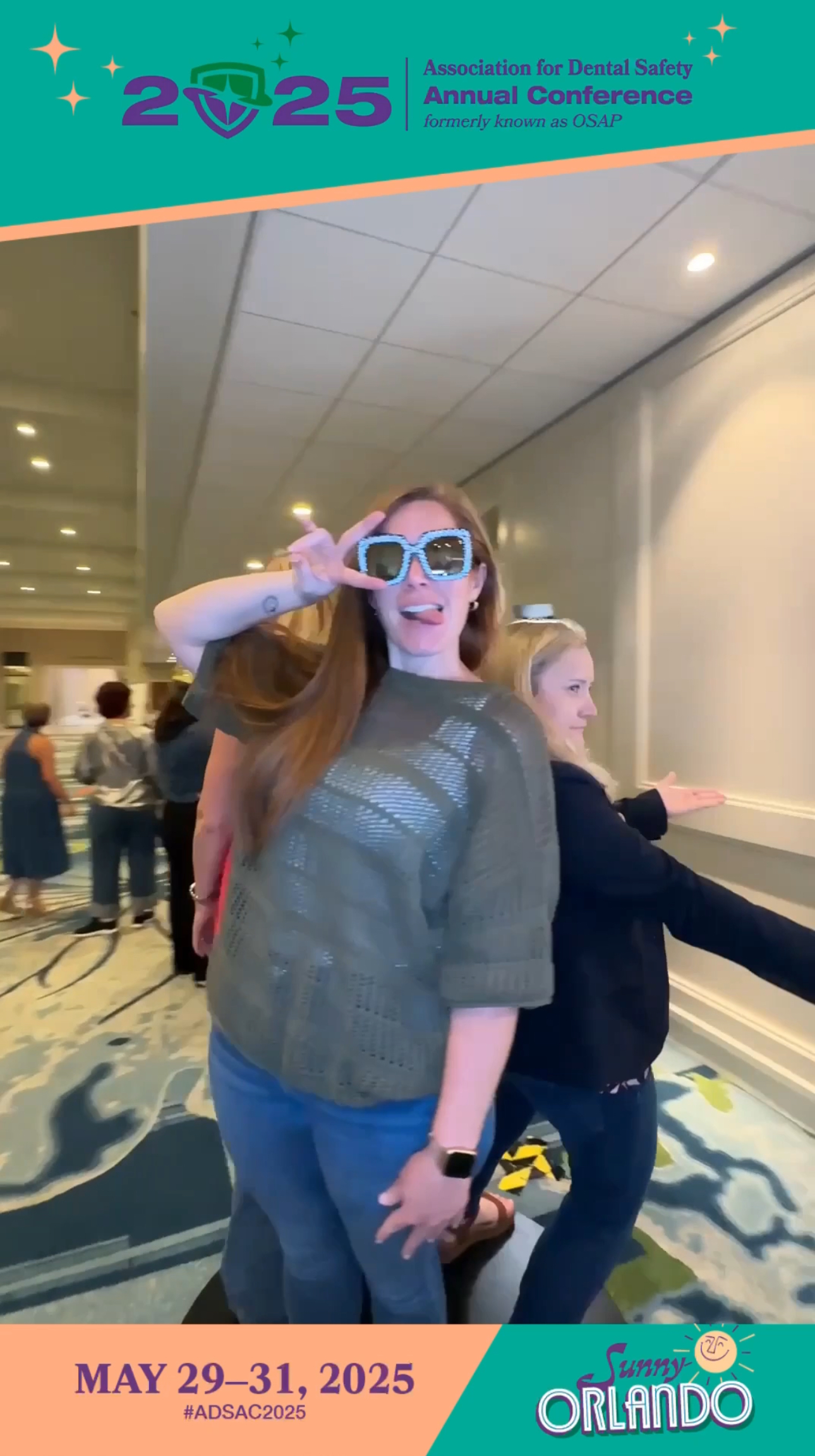 Two professional women enjoying BOMBA Creative Co 360 photo booth experience at Association for Dental Safety annual conference, Hyatt Regency Grand Cypress Resort Orlando - one wearing sparkly blue sunglasses and sequined top, both smiling and posing for luxury photo booth activation
