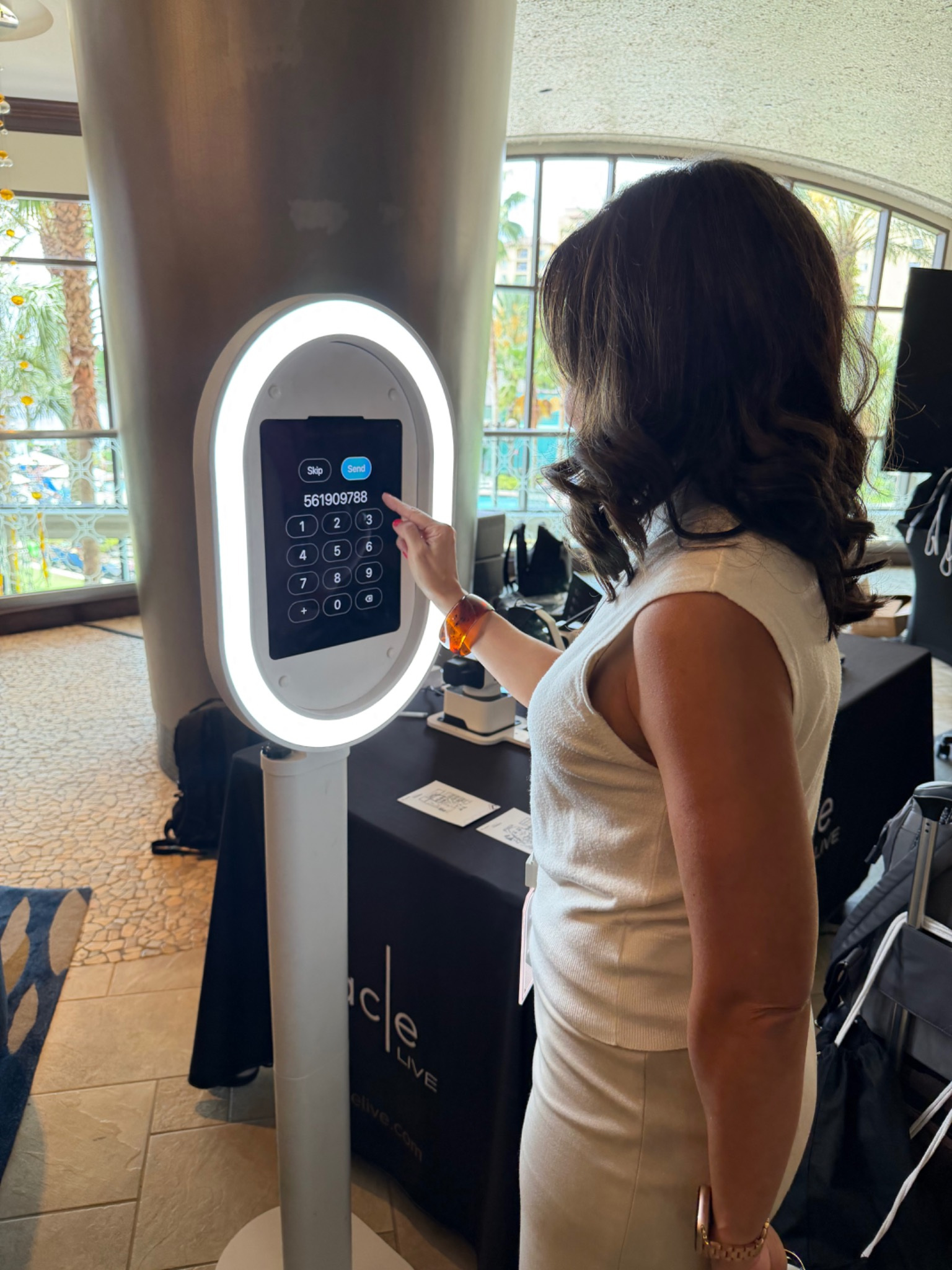 Digital Photo Booth Rental Orlando - guest using BOMBA Creative Co. photo booth for instant digital sharing